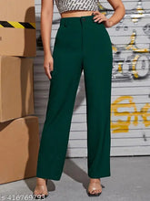 Green cotton blend bell-bottom trousers for women, solid design with front seam detail and elastic waistband. Ankle length with slim fit and stretchy fabric, suitable for casual or office wear. Made by Marc Laurent in India